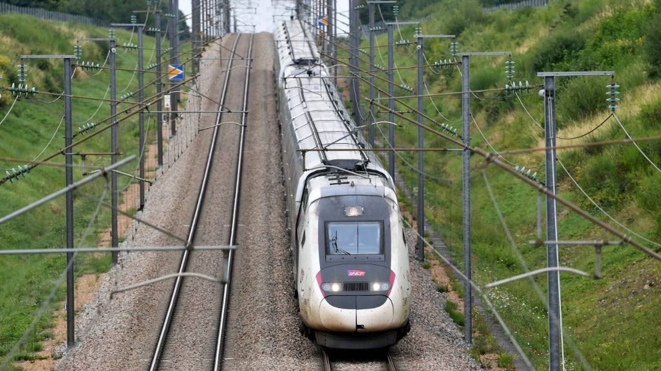 A high-speed train by French railway company SNCF travels on the Bordeaux-Paris route at reduced speed, at Chartres, northern France on July 26, 2024, after the resumption of high speed train services on the line between Paris and Bordeaux, following suspected acts of sabotage on the country's rail network ahead of the opening ceremony of the 2024 Paris Olympic Games. France's rail network was paralysed by coordinated acts of sabotage which knocked out most of its high-speed train services hours before the Paris Olympics opening ceremony. French rail operator SNCF said three night-time arson attacks had destroyed cabling boxes at strategic junctions around its network at locations north, south-west and east of Paris. (Photo by JEAN-FRANCOIS MONIER / AFP)