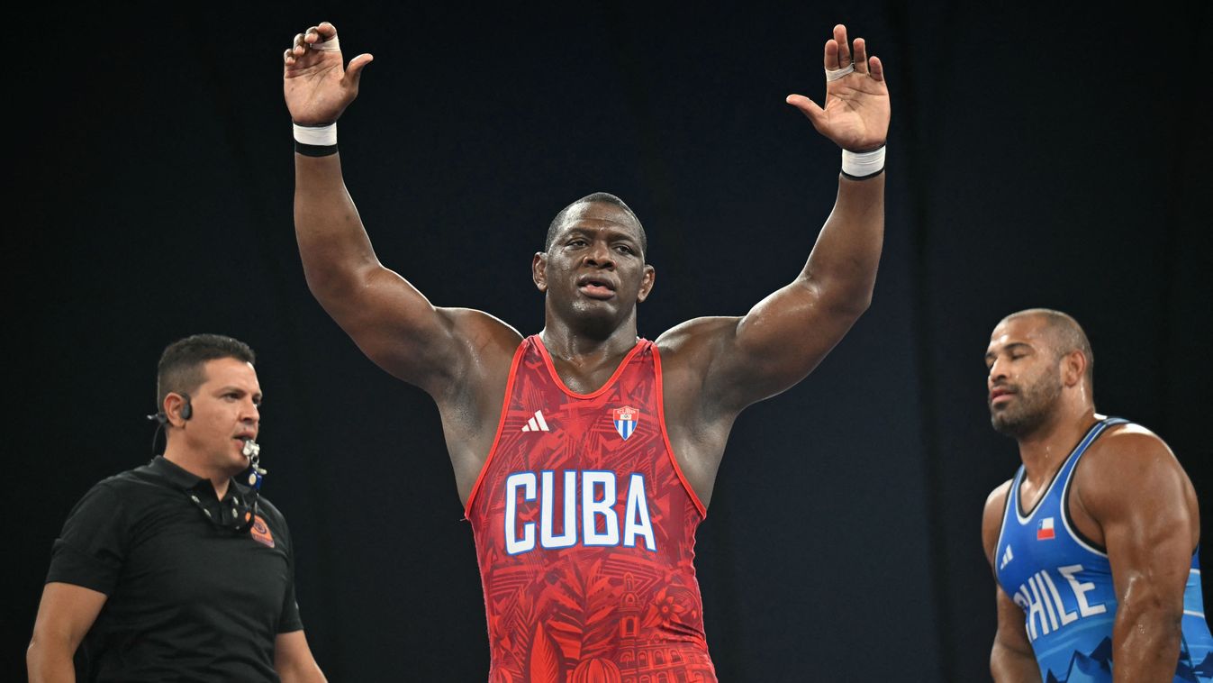 Mijain Lopez Nunez reacts to his win over Chile's Yasmani Acosta Fernandez in their men's greco-roman 130kg wrestling final match at the Champ-de-Mars Arena during the Paris 2024 Olympic Games, in Paris on August 6, 2024. (Photo by Punit PARANJPE / AFP)