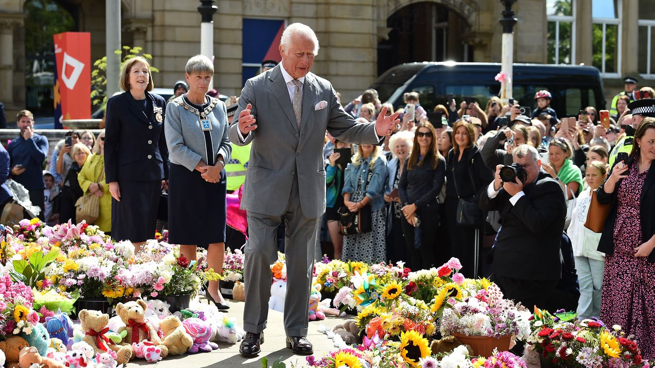 Britain's King Charles III reacts as he views tributes outside Southport Town Hall, during his visit to meet with members of the local community, following the July 29 attack at a childrens' dance party, in Southport, northwest England, on August 20, 2024. Alice Da Silva Aguiar, Bebe King, and Elsie Dot Stancombe were all murdered during the July 29 knife attack at a Taylor Swift-themed dance party that also left another 10 people injured. (Photo by PETER POWELL / AFP)