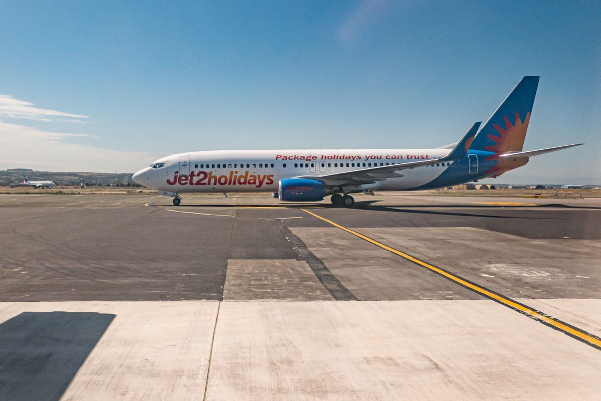 JET2 Boeing 737 In Thessaloniki Airport
Jet2 Boeing 737-800 aircraft as seen taxiing in Thessaloniki International Airport Makedonia SKG LGTS from a plane window. The 22 years old B738 airplane has the registration G-DRTB and logo of jet2holidays a subsidiary of jet2.com LS EXS, the British low-cost leisure airline with charter and scheduled flights from the United Kingdom with a fleet of 90 planes. Greece a country depending on tourism, the travel and aviation industry had increased international arrivals in summer season 2021 for holidays compared to 2020, trying to bounce back the effects of the Covid-19 Coronavirus pandemic in the economy. Thessaloniki airport is the gateway to Halkidiki popular tourist destination known for the beaches. Thessaloniki, Greece on October 2, 2021 (Photo by Nicolas Economou/NurPhoto) (Photo by Nicolas Economou / NurPhoto / NurPhoto via AFP)