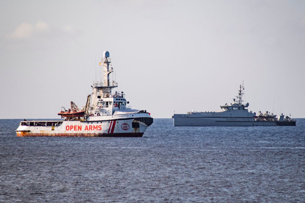 The Spanish migrant rescue NGO ship Open Arms is seen off the coast of the Italian island of Lampedusa on August 17, 2019. Twenty-seven unaccompanied minors have been authorised to leave a migrant rescue vessel in limbo off Italy, the Spanish charity operating the ship said. Italian Far-right Interior Minister Matteo Salvini wrote in a letter to Prime Minister Giuseppe Conte that he could authorise the "alleged" minors to leave the Open Arms ship despite such a move being "divergent to my orientation." (Photo by Alessandro SERRANO / AFP) / Italy OUT