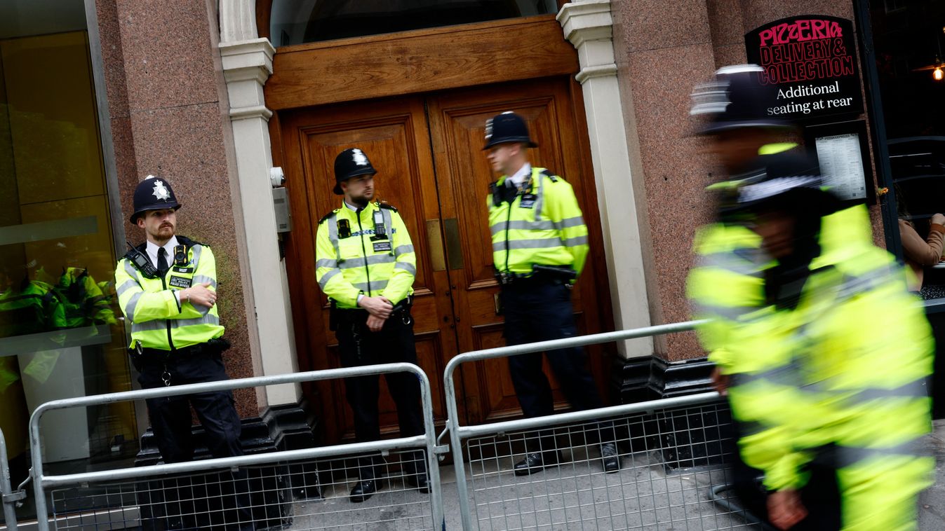 Police officers stand on duty outside the entrace to a building housing the headquarters of the Reform UK political party, during a "Stop the Far-right" demonstration on a National Day of Protest, in London on August 10, 2024. Brexit activist Nigel Farage, whose anti-immigration Reform UK party won 14 percent of the vote on the July 4 general election, has suggested the recent rioting stems from legitimate grievances about immigration, rather than simply far-right thuggery, and warned worse could be seen on the streets. (Photo by BENJAMIN CREMEL / AFP)