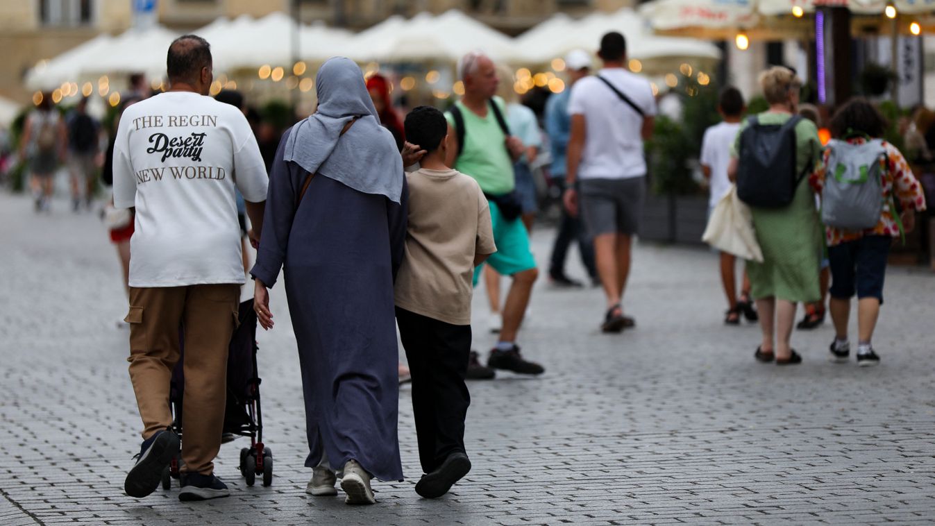 Daily Life In Krakow
A family of tourists from the Middle East is seen on the Main Market Square in Krakow, Poland, on August 19, 2024. (Photo by Klaudia Radecka/NurPhoto) (Photo by Klaudia Radecka / NurPhoto / NurPhoto via AFP)