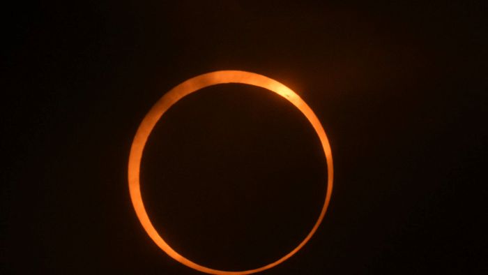 A man prepares his camera to view the annular solar eclipse at Isla de Pascua in the Pacific Ocean, Chile, on October 2, 2024. Part of the southern hemisphere will witness this Wednesday an annular eclipse that will occur when the Moon almost totally covers the Sun, leaving a luminous ring visible, a spectacle that will be seen in its maximum splendor from the Chilean and Argentinean Patagonia. (Photo by Jonathan MARTINS / AFP)