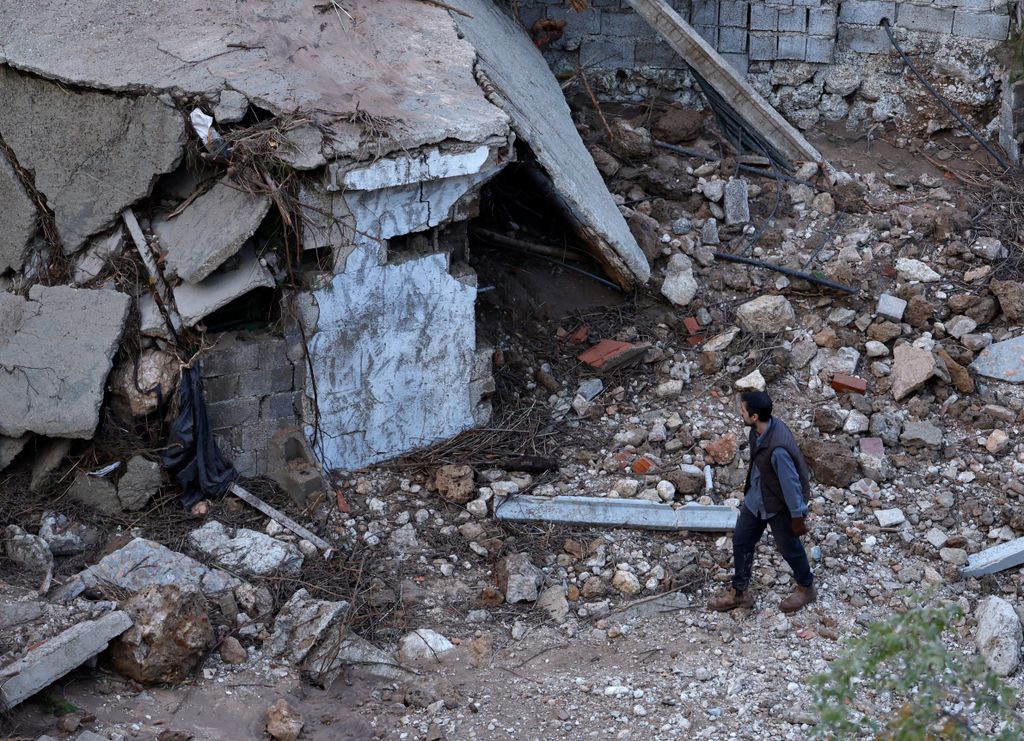 A man seeks a missing relative following deadly floods in Letur, southwest of Valencia, eastern Spain, on October 30, 2024. Floods triggered by torrential rains in Spain's eastern Valencia region has left at least 70 people dead, rescue services said on October 30. (Photo by OSCAR DEL POZO / AFP)