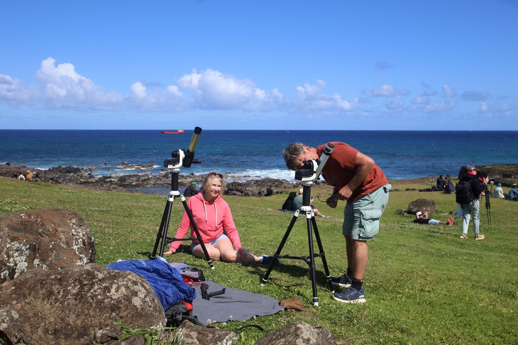 Residents and tourists prepare to view the annular solar eclipse at Isla de Pascua in the Pacific Ocean, Chile, on October 2, 2024. Part of the southern hemisphere will witness this Wednesday an annular eclipse that will occur when the Moon almost totally covers the Sun, leaving a luminous ring visible, a spectacle that will be seen in its maximum splendor from the Chilean and Argentinean Patagonia. (Photo by Jonathan MARTINS / AFP)