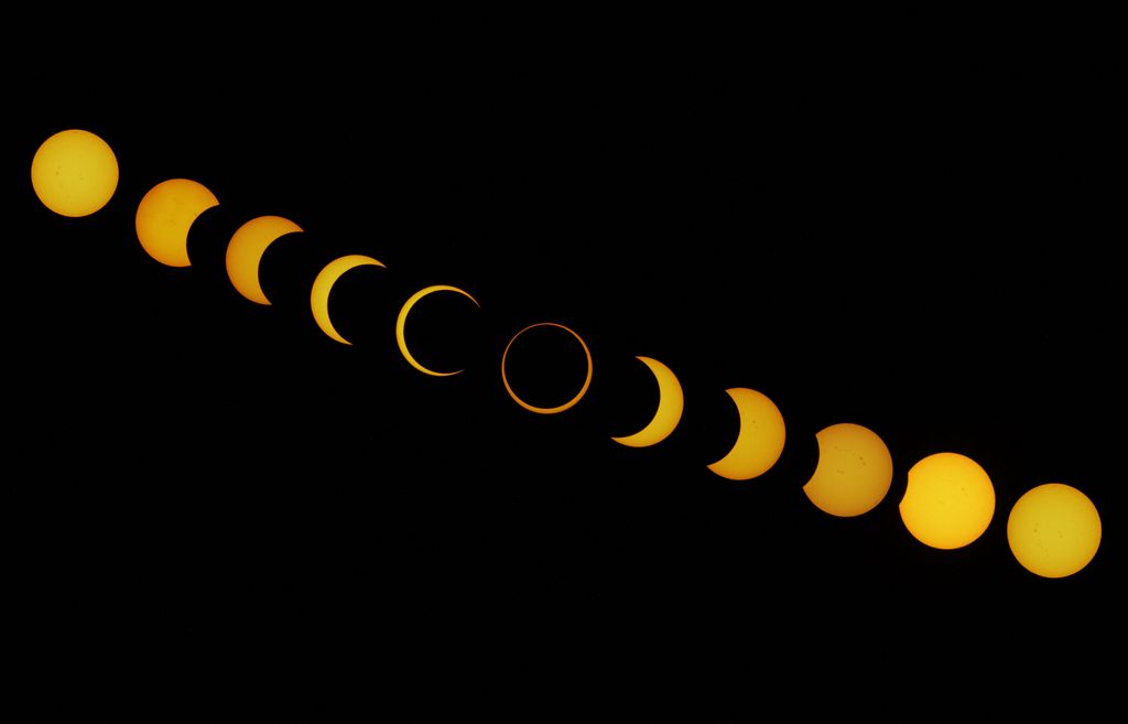 This combination of pictures shows different stages of the solar eclipse as seen from Isla de Pascua in the Pacific Ocean, Chile, on October 2, 2024. (Photo by JONATHAN MARTINS / AFP)