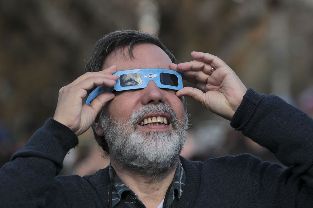 Solar eclipse in Chile
COYHAIQUE, CHILE - OCTOBER 02: A man looks toward the sky with protective filtered glasses to observe a solar eclipse in Coyhaique, Chile, on October 02, 2024. Part of the southern hemisphere witnessed an annular eclipse on Wednesday that occurred when the Moon almost completely covered the Sun, a spectacle that was seen from Chilean and Argentine Patagonia. Lucas Aguayo Araos / Anadolu (Photo by Lucas Aguayo Araos / ANADOLU / Anadolu via AFP)