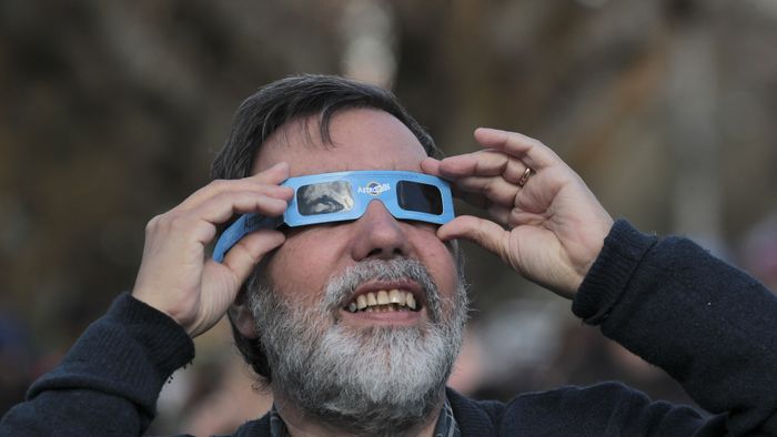 Solar eclipse in Chile
COYHAIQUE, CHILE - OCTOBER 02: A man looks toward the sky with protective filtered glasses to observe a solar eclipse in Coyhaique, Chile, on October 02, 2024. Part of the southern hemisphere witnessed an annular eclipse on Wednesday that occurred when the Moon almost completely covered the Sun, a spectacle that was seen from Chilean and Argentine Patagonia. Lucas Aguayo Araos / Anadolu (Photo by Lucas Aguayo Araos / ANADOLU / Anadolu via AFP)