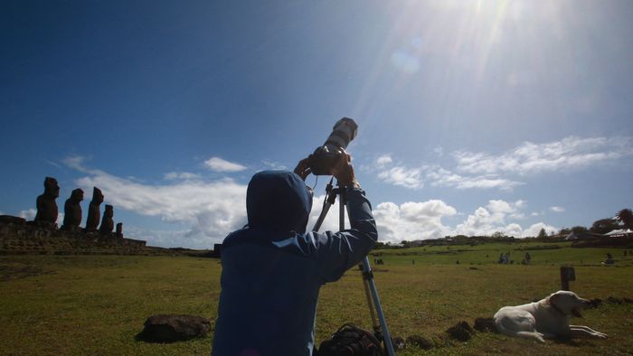 A man prepares his camera to view the annular solar eclipse at Isla de Pascua in the Pacific Ocean, Chile, on October 2, 2024. Part of the southern hemisphere will witness this Wednesday an annular eclipse that will occur when the Moon almost totally covers the Sun, leaving a luminous ring visible, a spectacle that will be seen in its maximum splendor from the Chilean and Argentinean Patagonia. (Photo by Jonathan MARTINS / AFP)