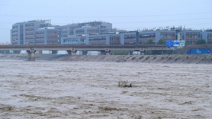 A picture taken on October 30, 2024 shows the Turia river following floods in Valencia, eastern Spain. Floods triggered by torrential rains in Spain's eastern Valencia region has left 51 people dead, rescue services said on October 30. (Photo by Jose Jordan / AFP)