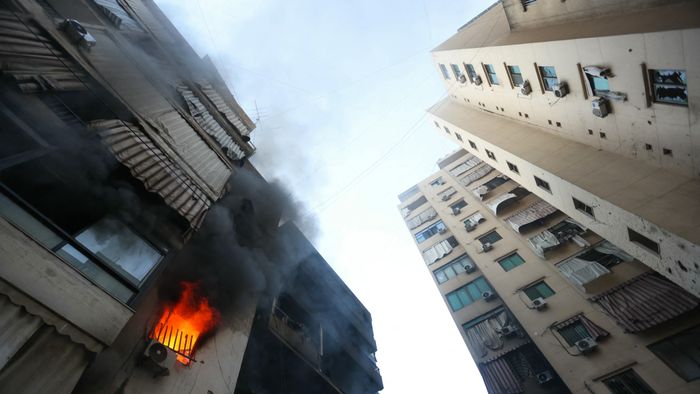 A fire burns in a damaged building at the site of overnight Israeli airstrikes on the Chiah neighbourhood in Beirut's southern suburbs on October 4, 2024. (Photo by Ibrahim AMRO / AFP)