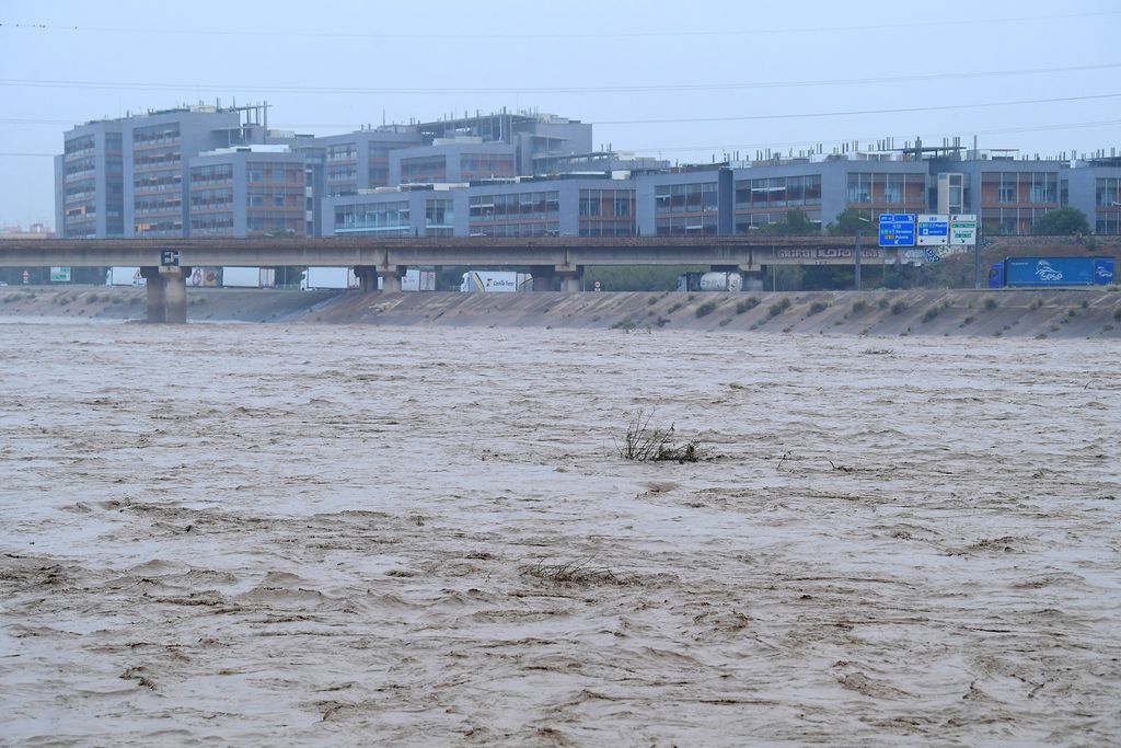 A picture taken on October 30, 2024 shows the Turia river following floods in Valencia, eastern Spain. Floods triggered by torrential rains in Spain's eastern Valencia region has left 51 people dead, rescue services said on October 30. (Photo by Jose Jordan / AFP)