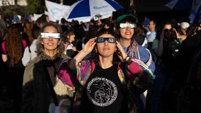 Argentina Protest
People watch an annular solar eclipse during a protest against Argentina's President Javier Milei's promise to veto a law to finance universities in Buenos Aires, Argentina, on October 2, 2024. (Photo by Matias Baglietto/NurPhoto) (Photo by Matías Baglietto / NurPhoto / NurPhoto via AFP)