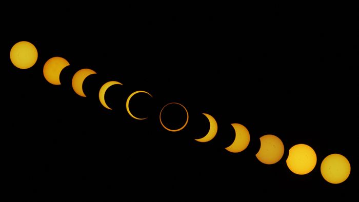 This combination of pictures shows different stages of the solar eclipse as seen from Isla de Pascua in the Pacific Ocean, Chile, on October 2, 2024. (Photo by JONATHAN MARTINS / AFP)