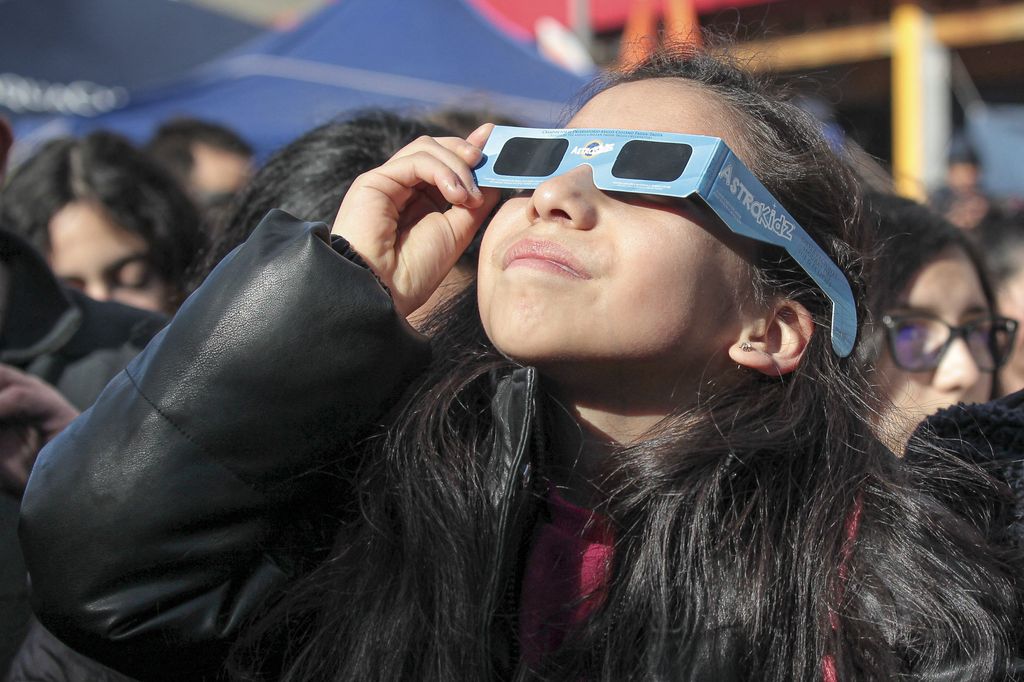 Solar eclipse in Chile
COYHAIQUE, CHILE - OCTOBER 02: People use special glasses to observe a solar eclipse in Coyhaique, Chile, on October 02, 2024. Part of the southern hemisphere witnessed an annular eclipse on Wednesday that occurred when the Moon almost completely covered the Sun, a spectacle that was seen from Chilean and Argentine Patagonia. Lucas Aguayo Araos / Anadolu (Photo by Lucas Aguayo Araos / ANADOLU / Anadolu via AFP)