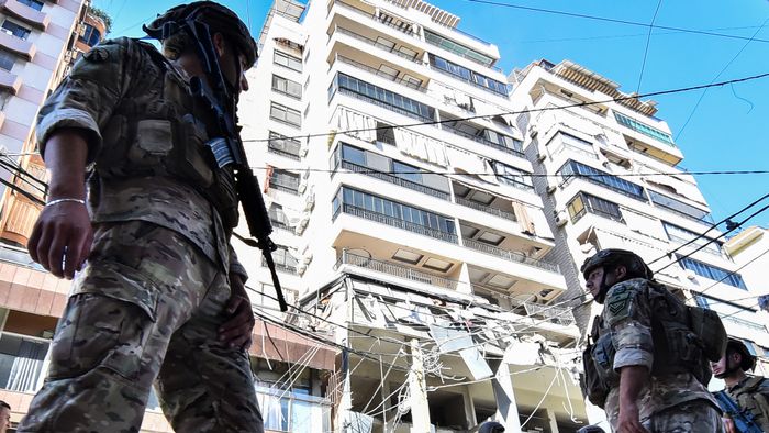 Lebanese army soldiers secure the area of an Israeli airstrike that targeted an apartment on al-Qaem street in Beirut’s southern suburbs on September 26, 2024. Israel flatly rejected on September 26 a push led by key backer the United States for a 21-day ceasefire in Lebanon, as it vowed to keep fighting Hezbollah militants "until victory". (Photo by Fadel ITANI / AFP)