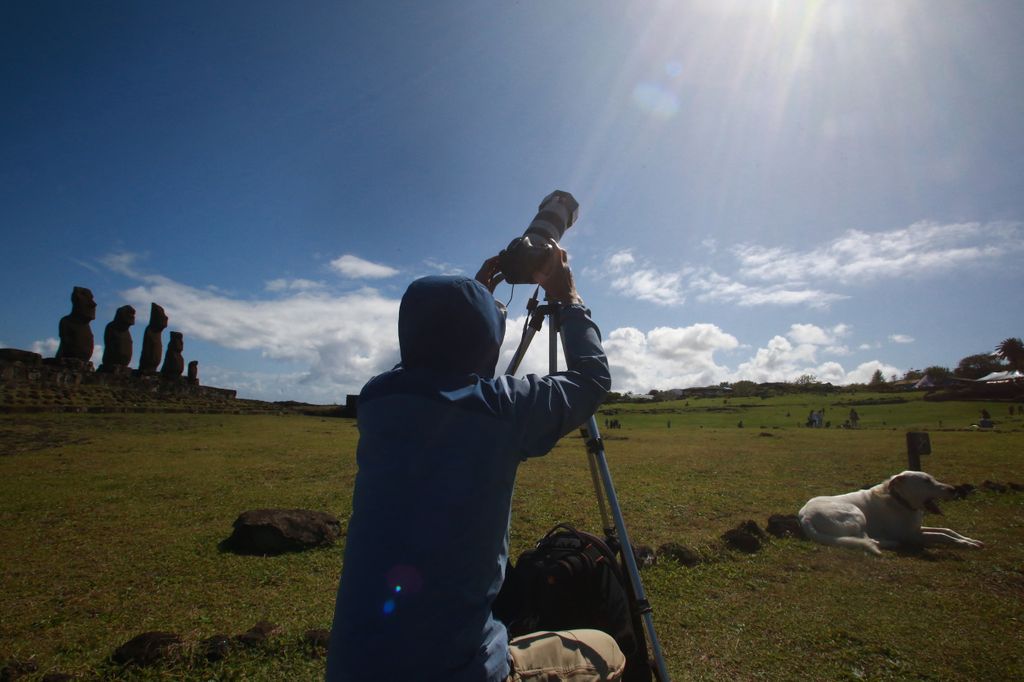 A man prepares his camera to view the annular solar eclipse at Isla de Pascua in the Pacific Ocean, Chile, on October 2, 2024. Part of the southern hemisphere will witness this Wednesday an annular eclipse that will occur when the Moon almost totally covers the Sun, leaving a luminous ring visible, a spectacle that will be seen in its maximum splendor from the Chilean and Argentinean Patagonia. (Photo by Jonathan MARTINS / AFP)