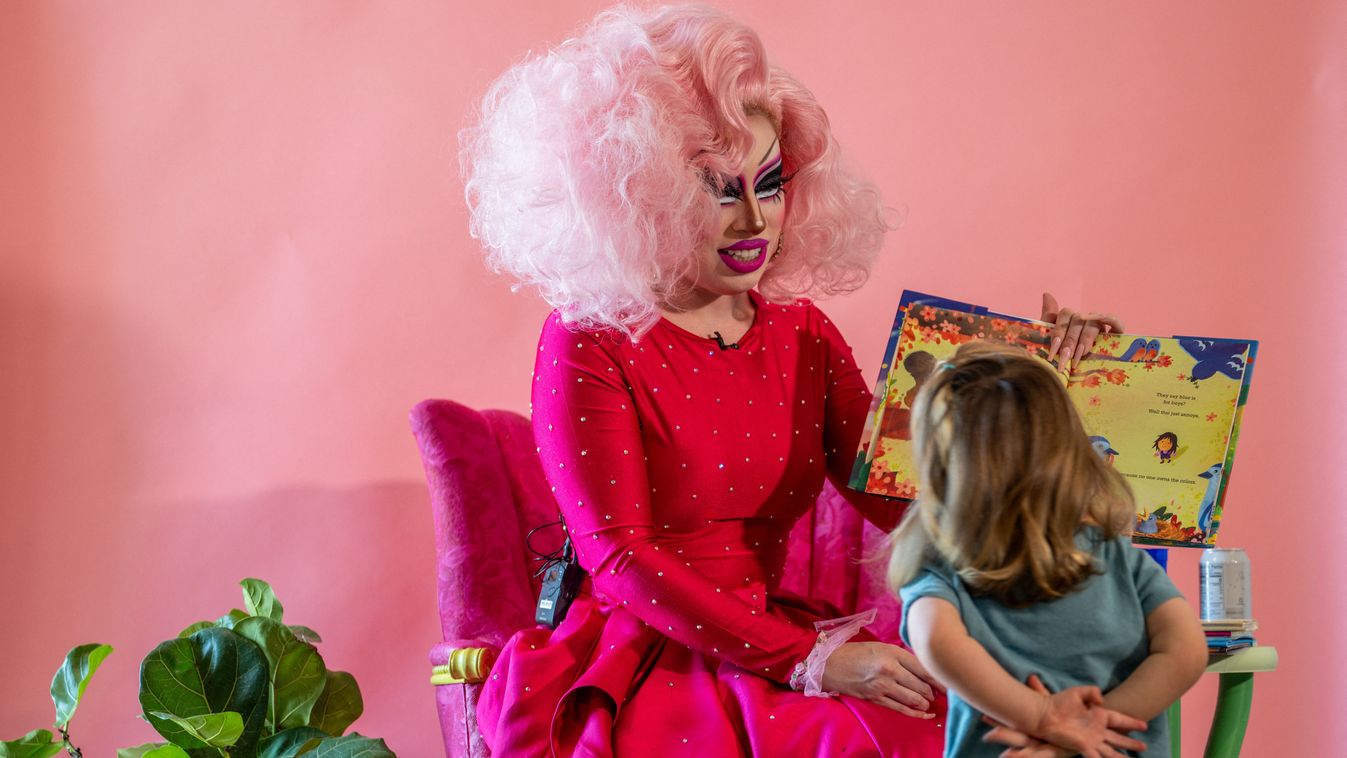 Drag Story-Time Event Held In Austin, Texas, Week Ahead Of Restrictive Bill Going Into Effect
AUSTIN, TEXAS - AUGUST 26: A child listens as Austin, Tx drag queen Brigitte Bandit reads a book during a drag time story hour at The Little Gay Shop fashion accessories store on August 26, 2023 in Austin, Texas. SB12, a bill seeking to regulate sexually oriented performances by restricting such performances on the premises of public property, or in the presence of individuals younger than 18 years of age, goes into effect September 1, 2023. The ACLU of Texas is representing local LGBTQ groups, businesses, and drag queen Brigitte Bandit in a lawsuit against state officials enforcing the bill. Among other claims, the lawsuit argues that the bill poses harm and unconstitutional censorship to several types of performers including Broadway plays, theater performances, cheerleading, and drag shows.   Brandon Bell/Getty Images/AFP (Photo by Brandon Bell / GETTY IMAGES NORTH AMERICA / Getty Images via AFP)