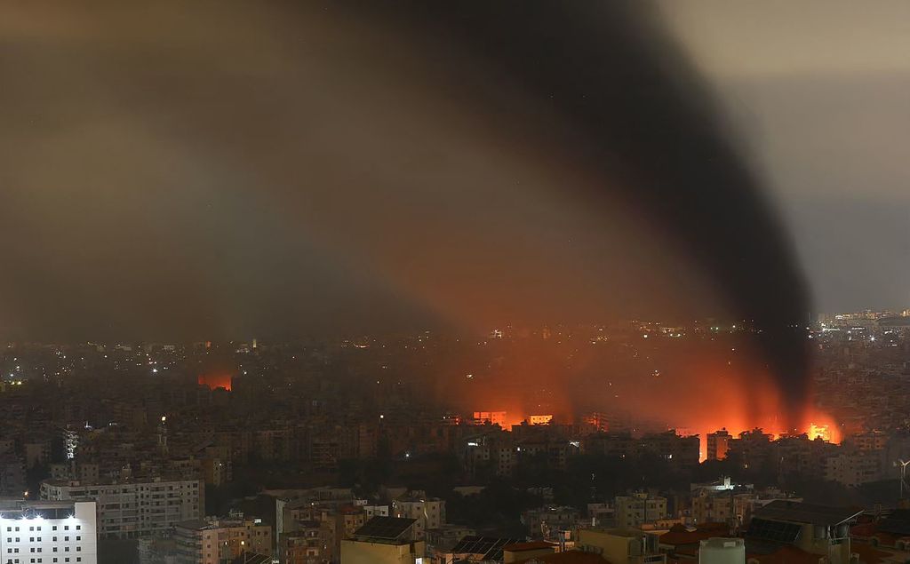 Smoke rises from the site of an Israeli airstrike that targeted a neighborhood in Beirut’s southern suburb late October 6, 2024. Official Lebanese media reported four Israeli strikes on south Beirut Sunday, shortly after calls by Israel's army for residents to evacuate the Hezbollah stronghold which has been bombarded for several days.
"Enemy warplanes launched two strikes on the southern suburbs, the first targeted the Saint Therese area, and the second targeted the Burj al-Barajneh area," Lebanon's National News Agency said. (Photo by STRINGER / AFP)