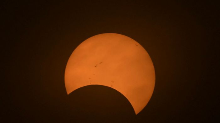 Partial view of the solar annular eclipse in Puerto San Julian, Santa Cruz province, Argentina, taken on October 2, 2024 (Photo by Juan MABROMATA / AFP)