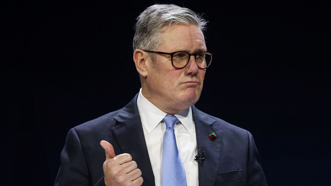 Britain's Prime Minister Keir Starmer gestures as he delivers a speech during the opening ceremony on stage on the first day of the Interpol general assembly, in Glasgow on November 4, 2024. (Photo by Russell Cheyne / POOL / AFP)