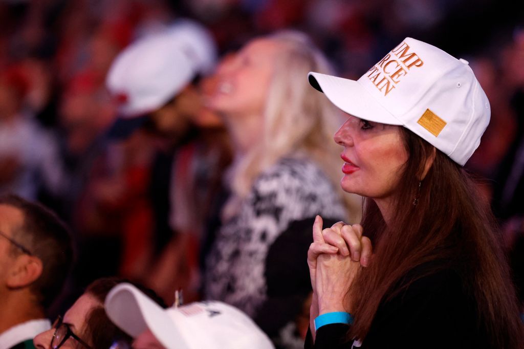 Attendees listen as former US President and Republican presidential candidate Donald Trump speaks during his last campaign rally at Van Andel Arena in Grand Rapids, Michigan on November 5, 2024. (Photo by JEFF KOWALSKY / AFP)