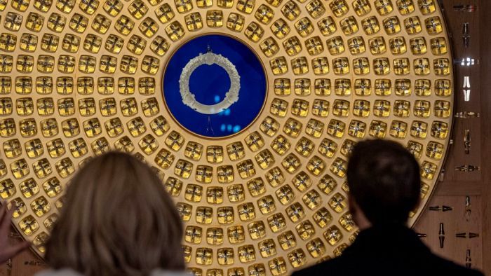 French President Emmanuel Macron (R) and his wife Brigitte Macron look at the Crown of Thorns and the reliquary of the Crown of Thorns designed by French artist Sylvain Dubuisson during their visit at the Notre-Dame de Paris Cathedral in Paris, on November 29, 2024. The Notre-Dame Cathedral is set to re-open early December 2024, with a planned weekend of ceremonies on December 7 and 8, 2024, five years after the 2019 fire which ravaged the world heritage landmark and toppled its spire. (Photo by Christophe PETIT TESSON / POOL / AFP) / RESTRICTED TO EDITORIAL USE - MANDATORY MENTION OF THE ARTIST UPON PUBLICATION - TO ILLUSTRATE THE EVENT AS SPECIFIED IN THE CAPTION