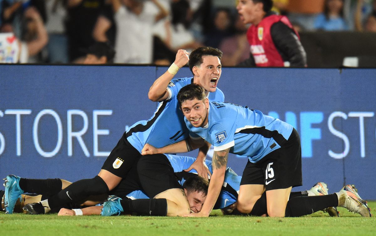 Uruguay's midfielder #05 Manuel Ugarte (bottom) celebrates with teammates after scoring his team third goal during the 2026 FIFA World Cup South American qualifiers football match between Uruguay and Colombia at the Centenario stadium in Montevideo on November 15, 2024. (Photo by DANTE FERNANDEZ / AFP) Darwin Nunez Szoboszlai Dominik Liverpool