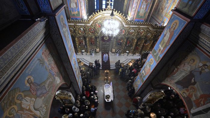 Relatives, colleagues and friends stand by the coffin of the combat medic Maria-Khrystyna Dvoinik, 32, during her funeral service at Saint Michael's Golden-domes Orthodox cathedral in Kyiv on November 15, 2024, amid Russian invasion in Ukraine. (Photo by Sergei SUPINSKY / AFP)