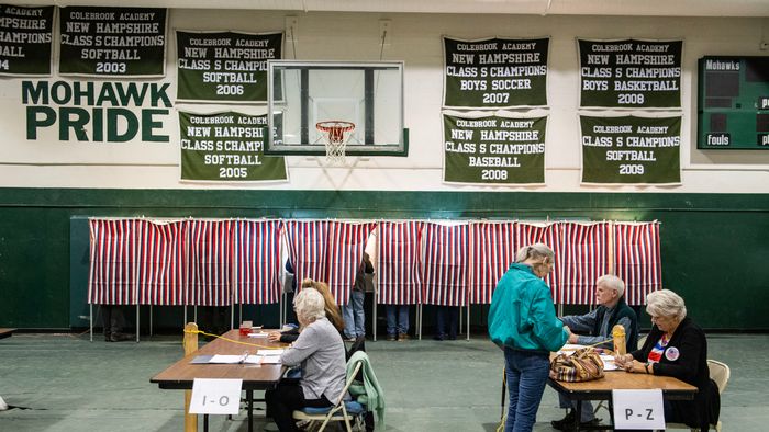 A woman checks in to vote at a polling station at Colebrook Academy and Elementary School in Colebrook, New Hampshire, on Election Day, November 5, 2024. (Photo by Joseph Prezioso / AFP)