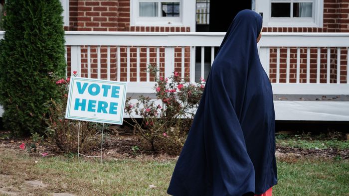 A muslim woman comes to vote at a polling station in Clarkston, Georgia, on Election Day, November 5, 2024. Clarkston, known as a hub for refugee resettlement following the Refugee Act of 1980, has a population of about 18,000, with approximately half being foreign-born residents representing over 40 countries, including Somalia, Ethiopia, Bhutan, and Vietnam. (Photo by Yasuyoshi CHIBA / AFP)