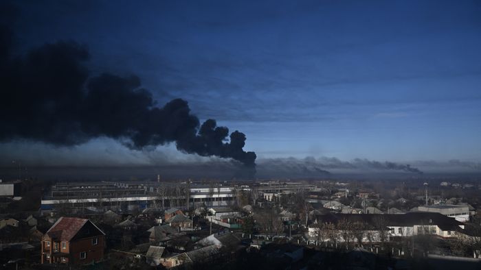 Black smoke rises from a military airport in Chuguyev near Kharkiv  on February 24, 2022. Russian President Vladimir Putin announced a military operation in Ukraine today with explosions heard soon after across the country and its foreign minister warning a "full-scale invasion" was underway. (Photo by Black smoke rises from a military airport in Chuguyev near Kharkiv  on February 24, 2022. Russian President Vladimir Putin announced a military operation in Ukraine today with explosions heard soon after across the country and its foreign minister warning a "full-scale invasion" was underway. (Photo by Aris Messinis / AFP))