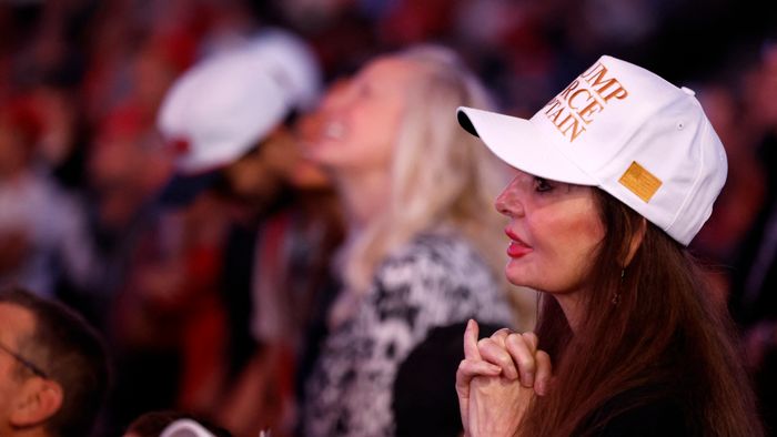 Attendees listen as former US President and Republican presidential candidate Donald Trump speaks during his last campaign rally at Van Andel Arena in Grand Rapids, Michigan on November 5, 2024. (Photo by JEFF KOWALSKY / AFP)