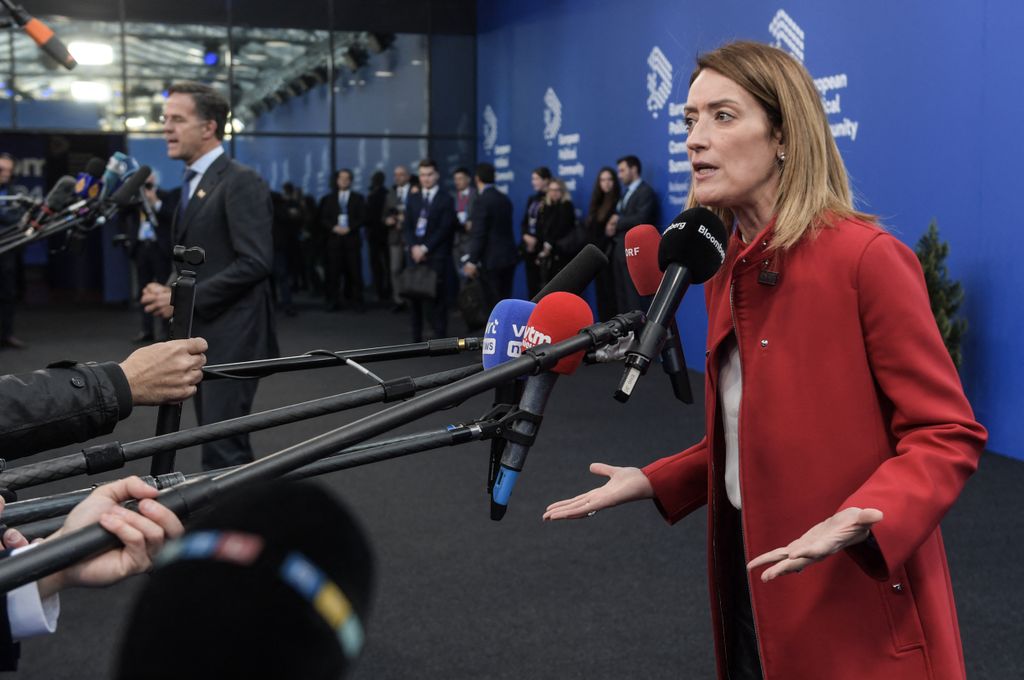 European Parliament President Roberta Metsola and NATO Secretary General Mark Rutte (back L) both give statesments as they arrive to attend the European Political Community Summit in Budapest, on November 7, 2024. (Photo by Ferenc ISZA / AFP)