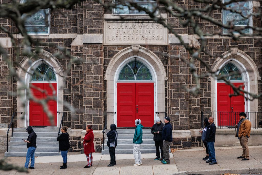 Voters line up outside of a polling station at St. John’s Windish Evangelical Lutheran Church before the polls open on Election Day in Bethlehem, Pennsylvania on November 5, 2024. (Photo by SAMUEL CORUM / AFP)