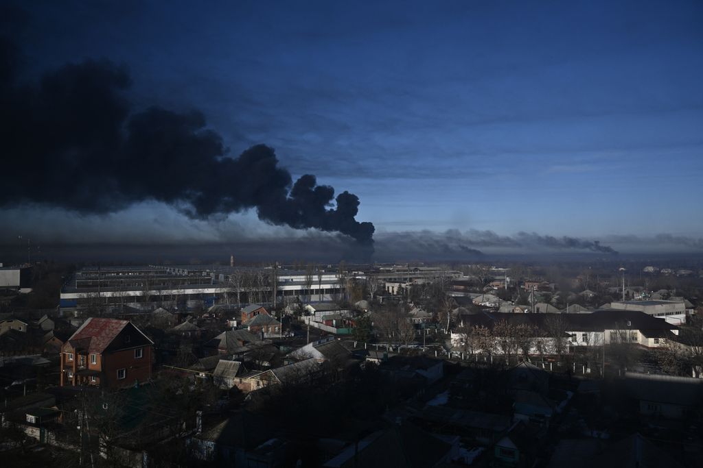 Black smoke rises from a military airport in Chuguyev near Kharkiv  on February 24, 2022. Russian President Vladimir Putin announced a military operation in Ukraine today with explosions heard soon after across the country and its foreign minister warning a "full-scale invasion" was underway. (Photo by Black smoke rises from a military airport in Chuguyev near Kharkiv  on February 24, 2022. Russian President Vladimir Putin announced a military operation in Ukraine today with explosions heard soon after across the country and its foreign minister warning a "full-scale invasion" was underway. (Photo by Aris Messinis / AFP))