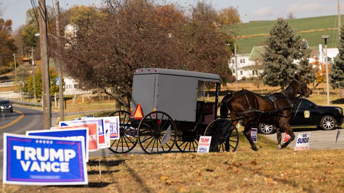 An Amish horse and buggy makes its way toward a polling location at the Leacock Township Municipal building in Intercourse, Pennsylvania, on Election Day, November 5, 2024. (Photo by RYAN COLLERD / AFP)