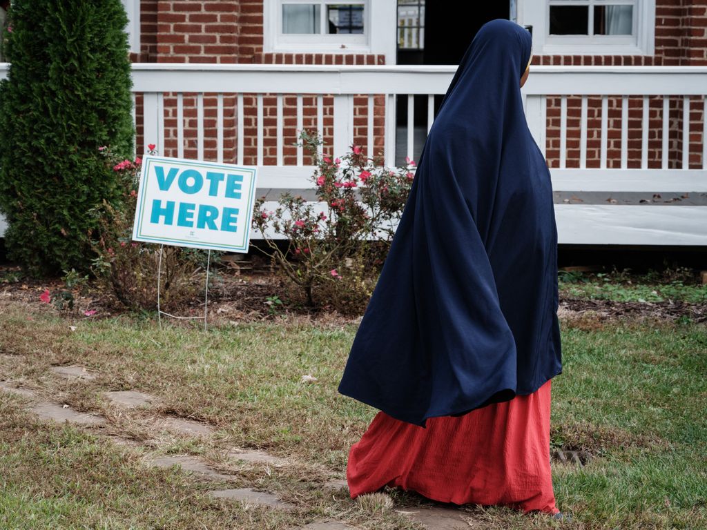 A muslim woman comes to vote at a polling station in Clarkston, Georgia, on Election Day, November 5, 2024. Clarkston, known as a hub for refugee resettlement following the Refugee Act of 1980, has a population of about 18,000, with approximately half being foreign-born residents representing over 40 countries, including Somalia, Ethiopia, Bhutan, and Vietnam. (Photo by Yasuyoshi CHIBA / AFP)