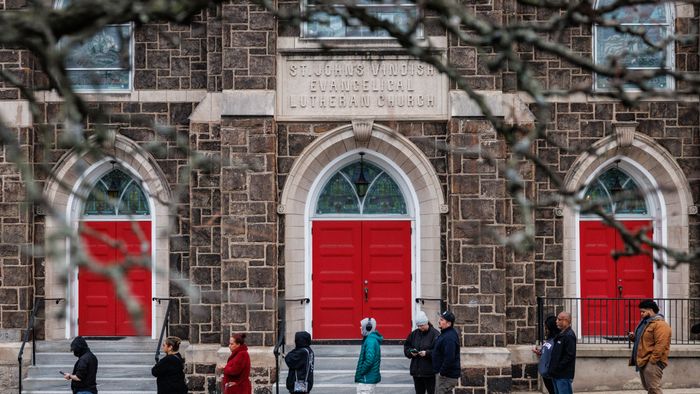 Voters line up outside of a polling station at St. John’s Windish Evangelical Lutheran Church before the polls open on Election Day in Bethlehem, Pennsylvania on November 5, 2024. (Photo by SAMUEL CORUM / AFP)