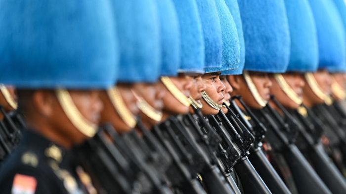 Thai Royal Guards take part in a rehearsal for "Trooping the Colour" and oath-giving ceremony to mark the 72nd birthday celebrations of Thailand's King Maha Vajiralongkorn at Dusit Palace in Bangkok on November 30, 2024. The December 3 ceremony is set to be the first "Trooping the Colour" parade and oath-giving in 16 years, and the first of such ceremonies to be held during the reign of Thailand's King Maha Vajiralongkorn. (Photo by MANAN VATSYAYANA / AFP)