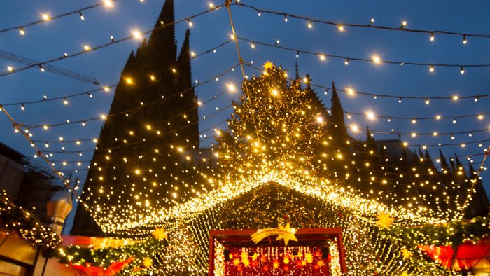 Christmas MarkVisitors check the stalls selling Christmas decorations at Cologne Christmas in front of Dam Cathedral in Cologne, Germany, on November 18, 2024. (Photo by Ying Tang/NurPhoto) (Photo by Ying Tang / NurPhoto / NurPhoto via AFP)et Opens In Cologne