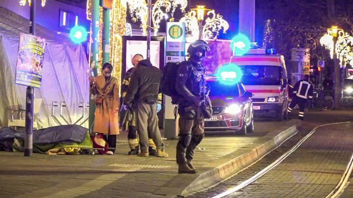 Video grab taken from a footege by News5 shows an injured person lying on a stretcher as police and ambulances stand next to the Christmas market, where a car crashed into a crowd injuring between "60 and 80 people", according to a spokesman for the local rescue service, on December 20, 2024 in Magdeburg, eastern Germany. According to the emergency service, several people were "severely" injured", the spokesman said. German media reported one person had died, although that was not yet confirmed by authorities. (Photo by Erik-Holm LANGHOF / NEWS5 / AFP)