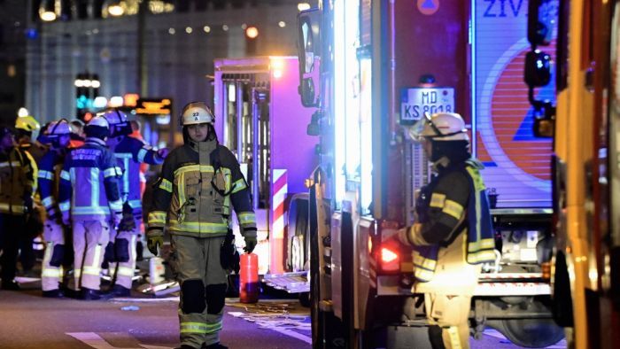 Ambulances and rescuers are seen after a car crashed into a crowd at a Christmas market injuring more than 60 people on December 20, 2024 in Magdeburg, eastern Germany. The death toll of the Magdeburg market attack rose to two according to the State Premier. (Photo by John MACDOUGALL / AFP)