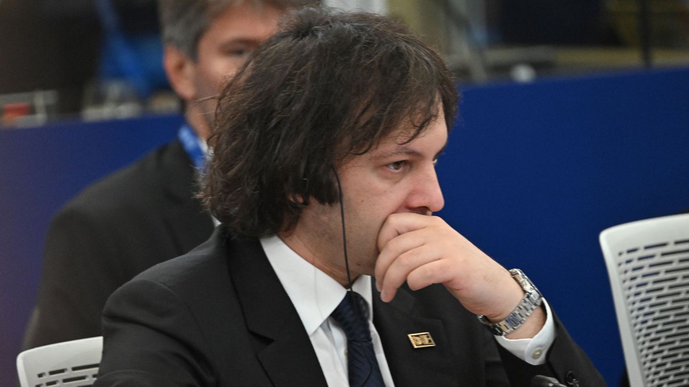 Georgia's Prime Minister Irakli Kobakhidze is pictured at the start of the opening plenary session presided by Hungary's Prime Minister Viktor Orban (on screen) at the European Political Community Summit in Budapest, on November 7, 2024. (Photo by Attila KISBENEDEK / AFP)