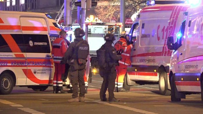 Police and ambulances stand next to the Christmas market, where a car crashed into a crowd injuring between "60 and 80 people", according to a spokesman for the local rescue service, on December 20, 2024 in Magdeburg, eastern Germany. According to the emergency service, several people were "severely" injured", the spokesman said. German media reported one person had died, although that was not yet confirmed by authorities. (Photo by NEWS5 / NEWS5 / AFP)