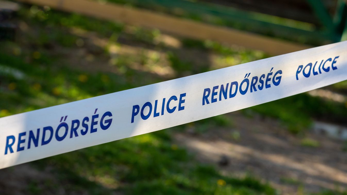 a close-up with a tape with the inscription Police in English and Hungarian language,rendőrség, police