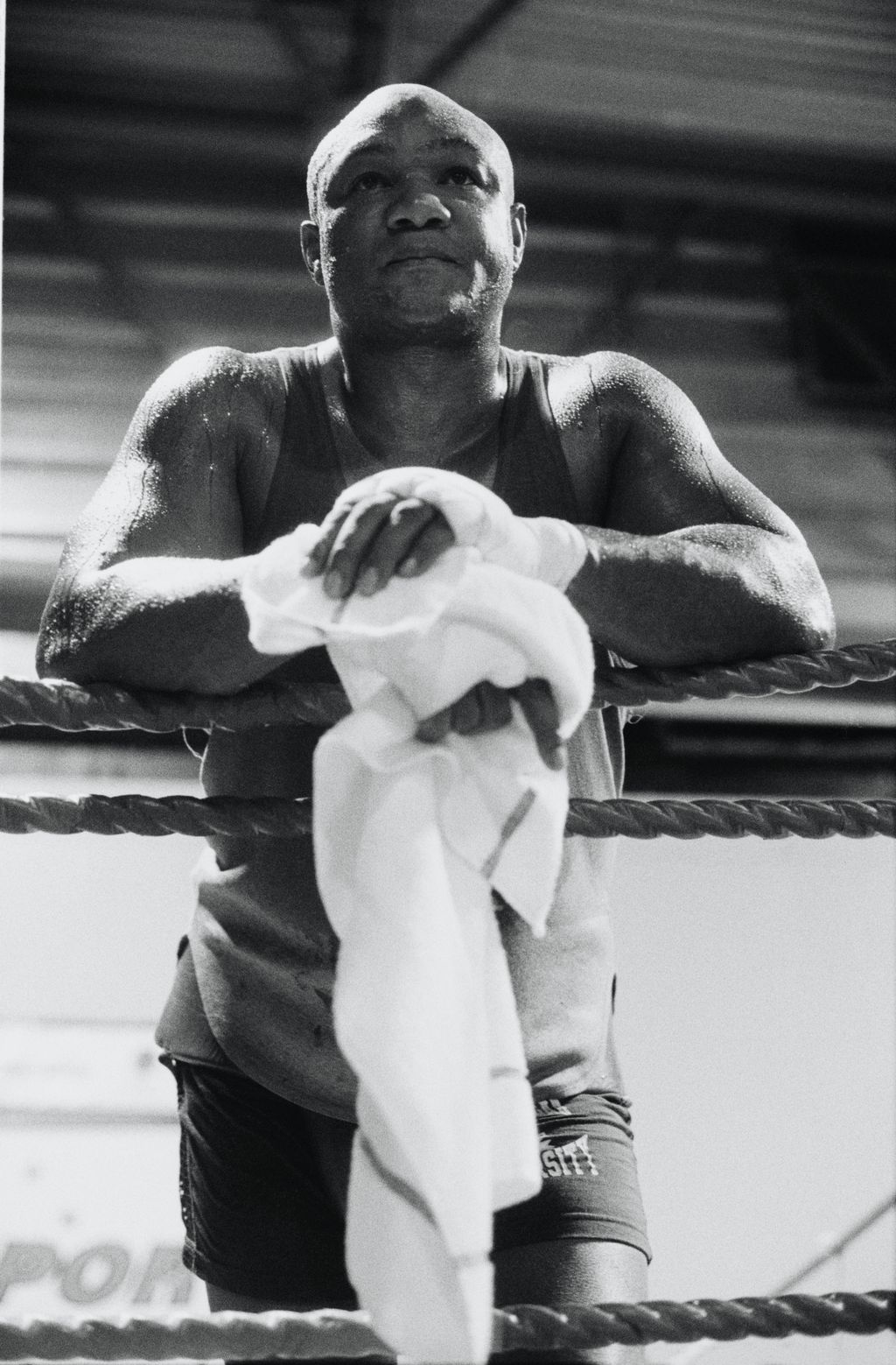 American professional boxer George Foreman rests on the ring rope during a training session prior to his fight with Terry Anderson at London Arena, London, 25th September 1990. (Photo by Glyn Howells/Hulton Archive/Getty Images)