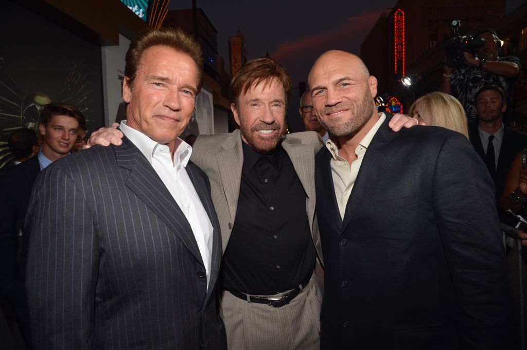 HOLLYWOOD, CA - AUGUST 15:  Actors Arnold Schwarzenegger, Chuck Norris and Randy Couture arrive at "The Expendables 2" Los Angeles Premiere at Grauman's Chinese Theatre on August 15, 2012 in Hollywood, California.  (Photo by Lester Cohen/WireImage)