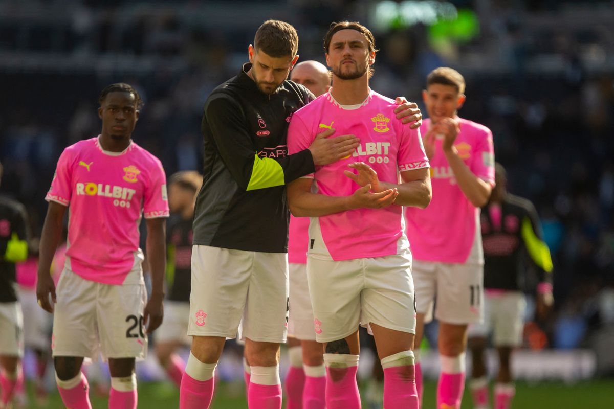 Jack Stephens of Southampton and Taylor Harwood-Bellis of Southampton look dejected after the Premier League match between Tottenham Hotspur and Southampton at the Tottenham Hotspur Stadium in London, England, on April 6, 2025. (Photo by David Watts | MI News/NurPhoto) (Photo by MI News / NurPhoto / NurPhoto via AFP)
